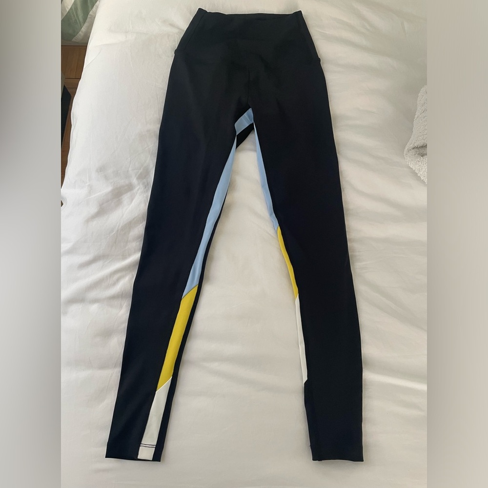 NEVER WORN Black leggings with a light blue, yellow and white stripe